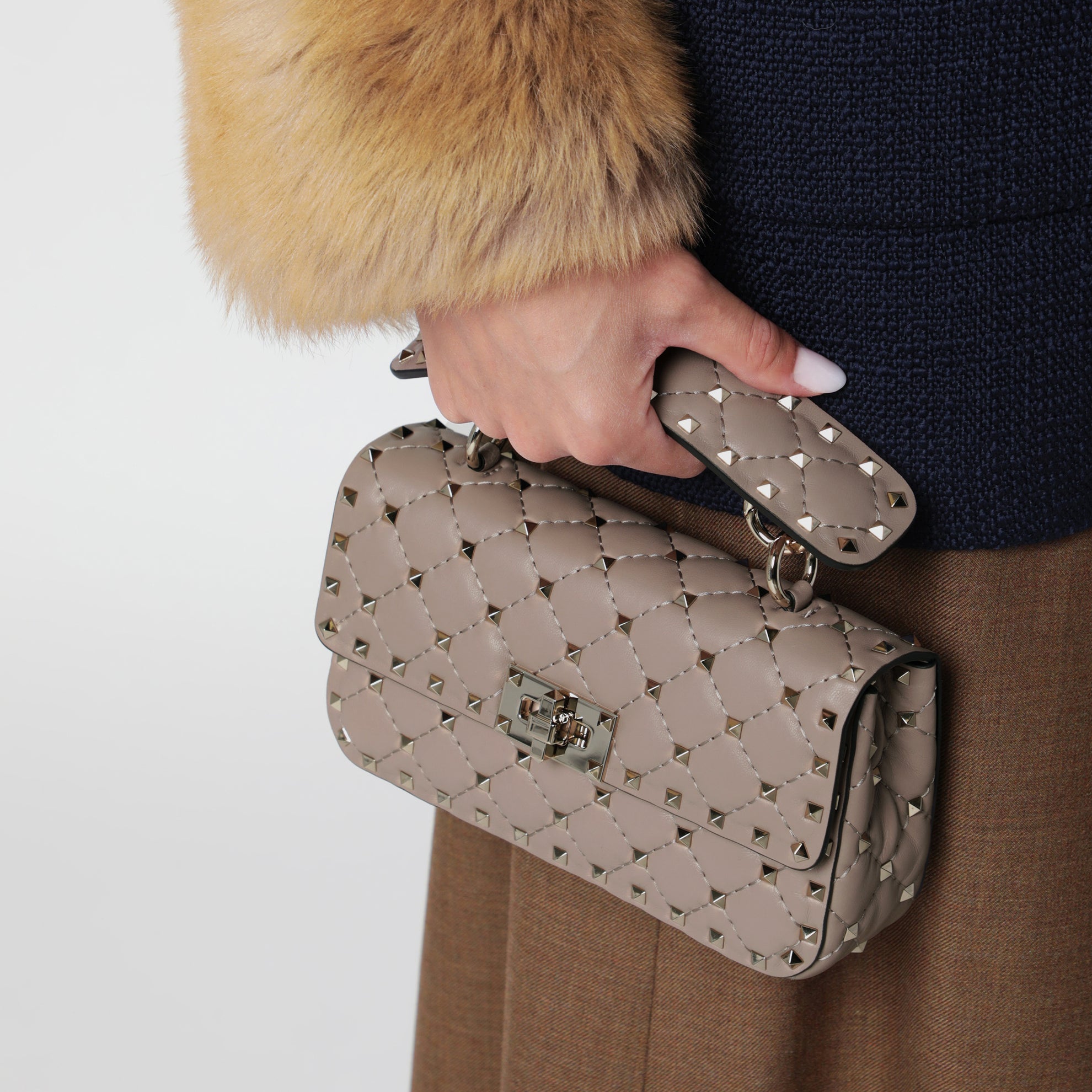 Mini Rockstud Spike top-handle bag in powder pink leather