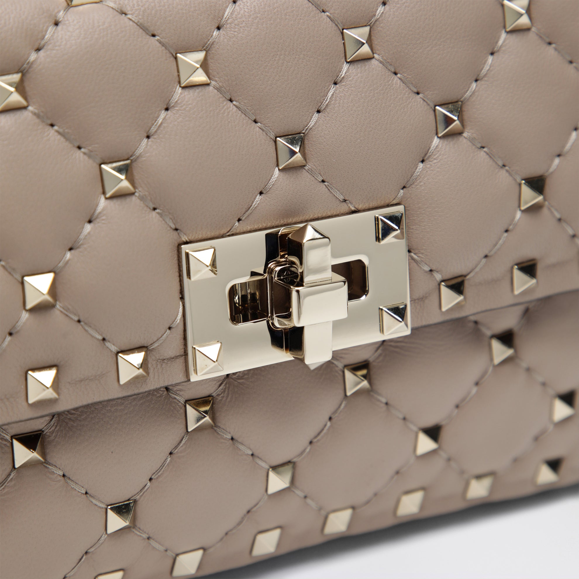Mini Rockstud Spike top-handle bag in powder pink leather