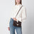 Borsa a tracolla piccola Rockstud marrone ebano in suede