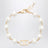 Bracciale VLogo Signature in metallo e perle oro/crema