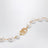 VLogo Signature bracelet in metal and pearls, gold/cream