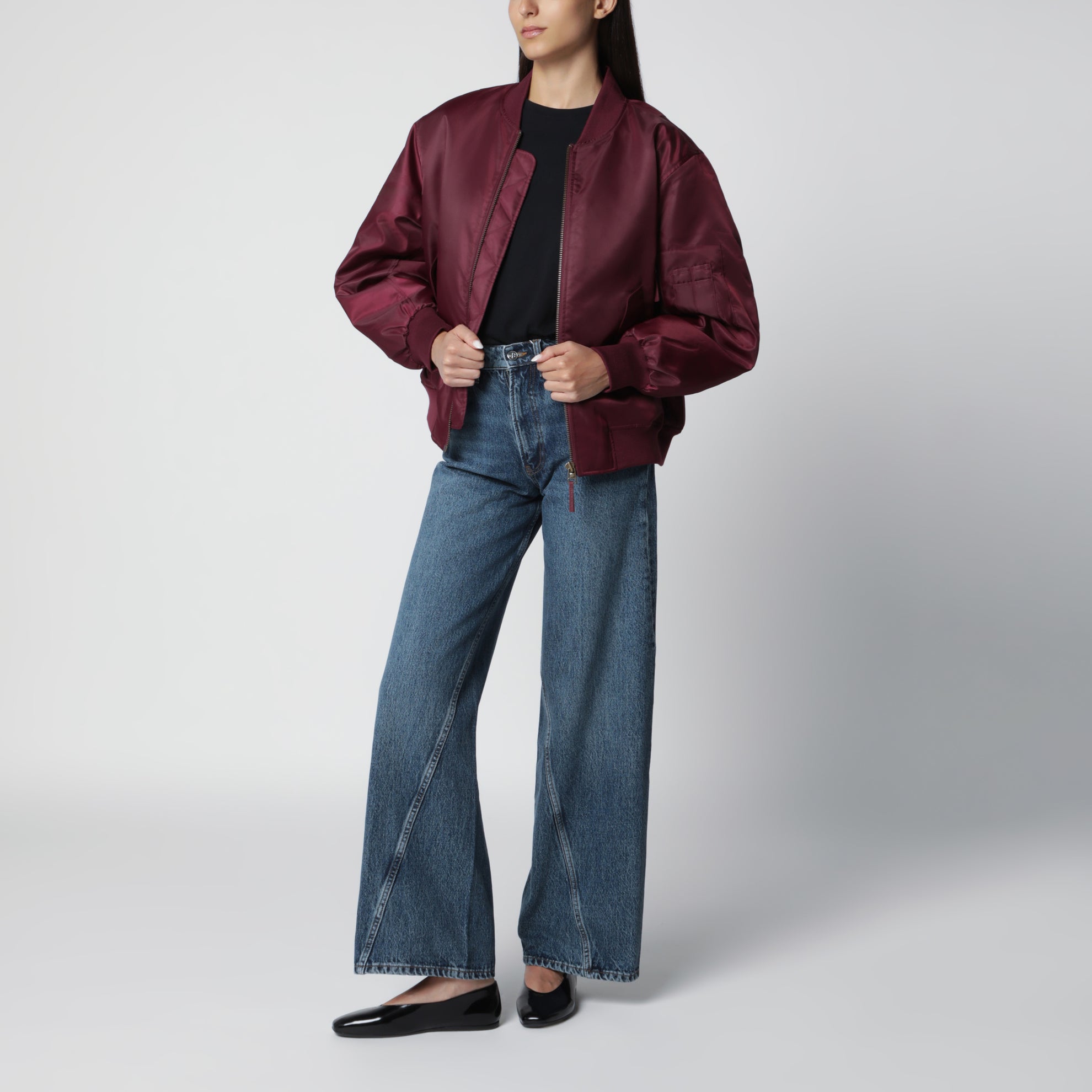 Washed blue jeans with curved front seams