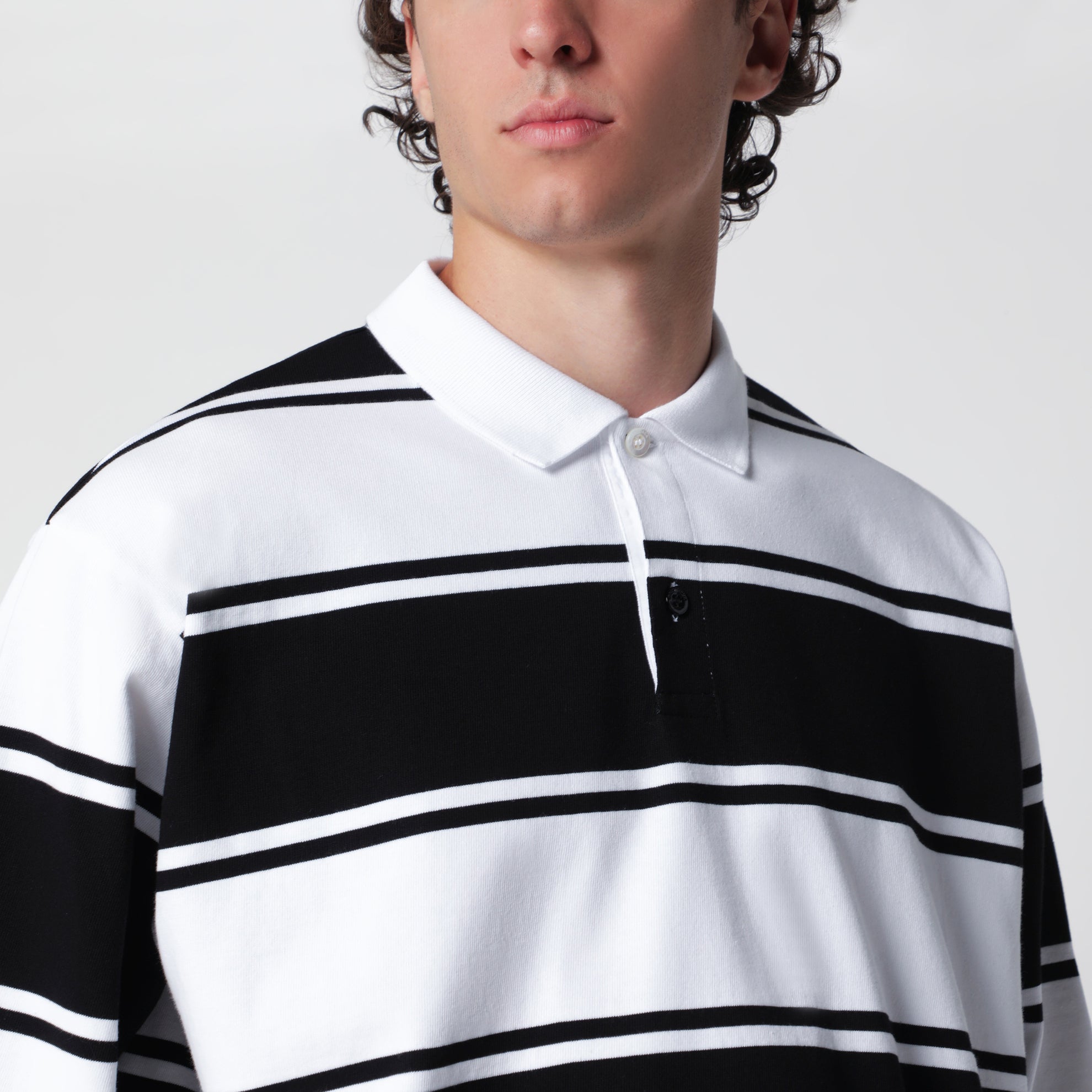 Polo a righe bianche/nere in cotone