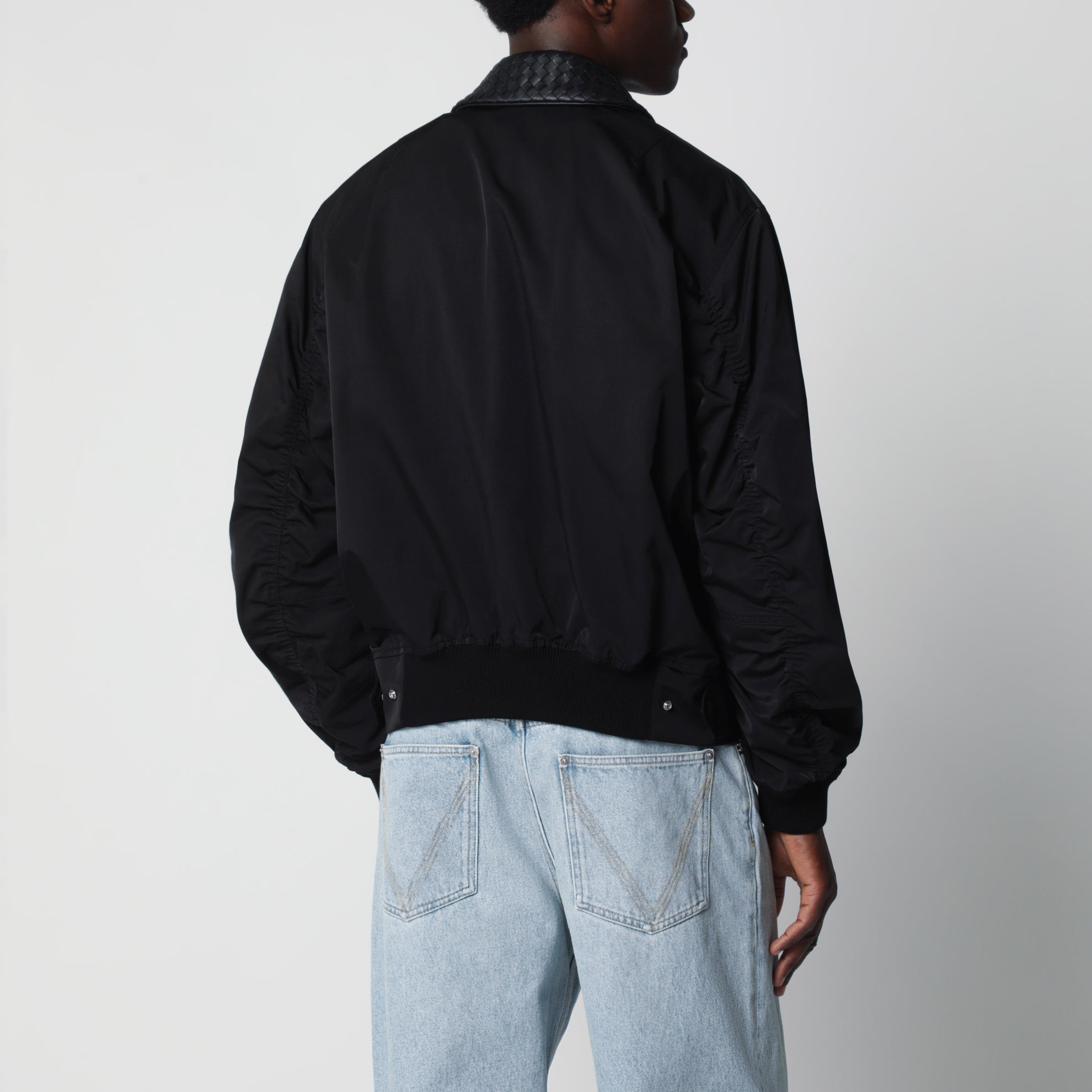 Black zip-up jacket with Intrecciato collar