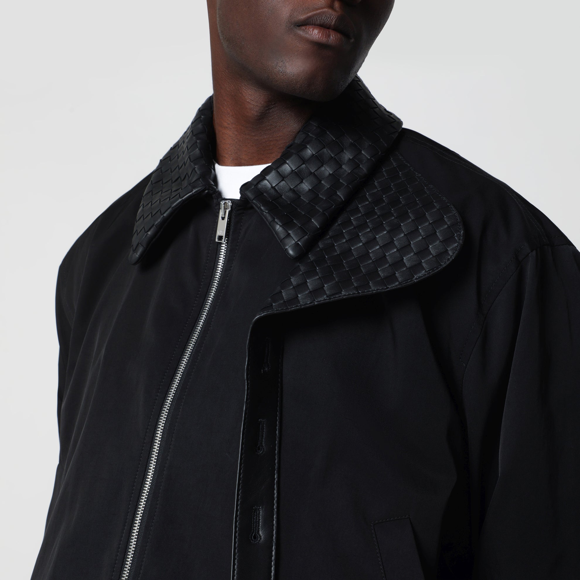 Black zip-up jacket with Intrecciato collar