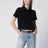 Black cropped cotton piqué polo shirt