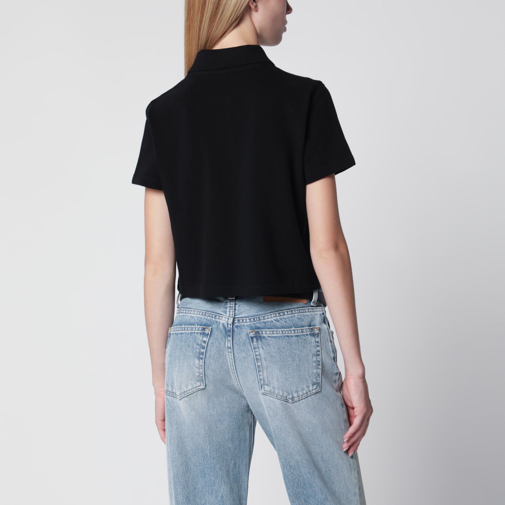 Polo cropped nera in piquet di cotone