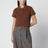 Polo cropped color caramello in piquet di cotone
