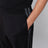 Pantalone jogging nero e grigio in tessuto tecnico