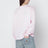 Light pink top with logo print