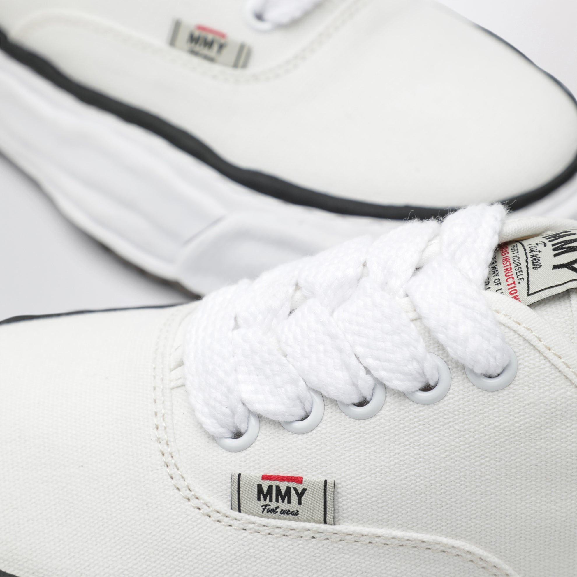 Sneakers Baker in tela bianche