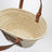 Basket bag in palm leaf and leather