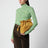Medium ochre Flamenco bag in suede