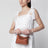 Borsa Puzzle Edge mini marrone in pelle granata