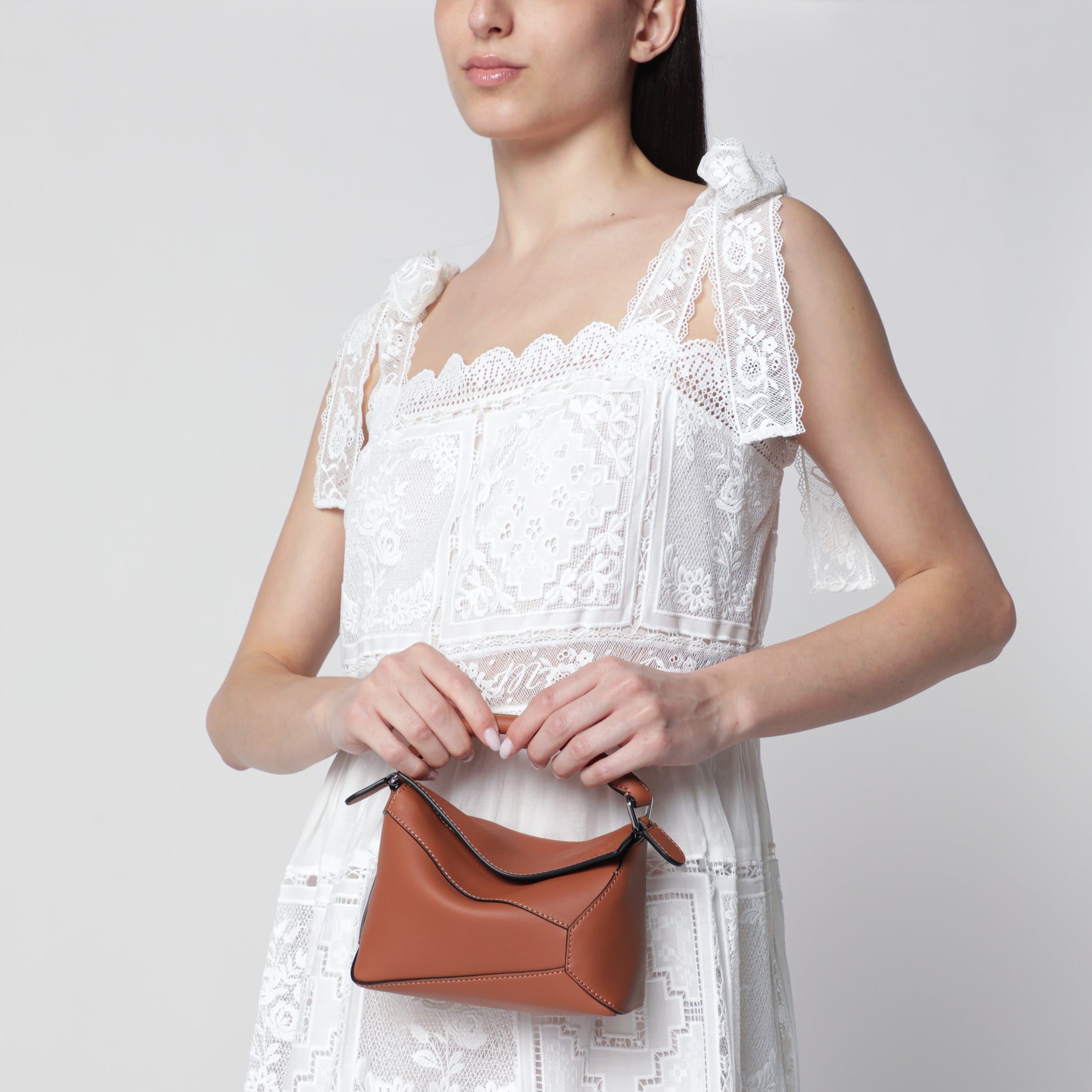 Borsa Puzzle Edge mini marrone in pelle granata