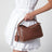 Petit sac Puzzle Featherlight en cuir nappa doré