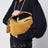 Borsa Featherlight Puzzle piccola color ocra in pelle scamosciata