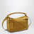 Borsa Featherlight Puzzle piccola color ocra in pelle scamosciata