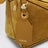 Borsa Featherlight Puzzle piccola color ocra in pelle scamosciata