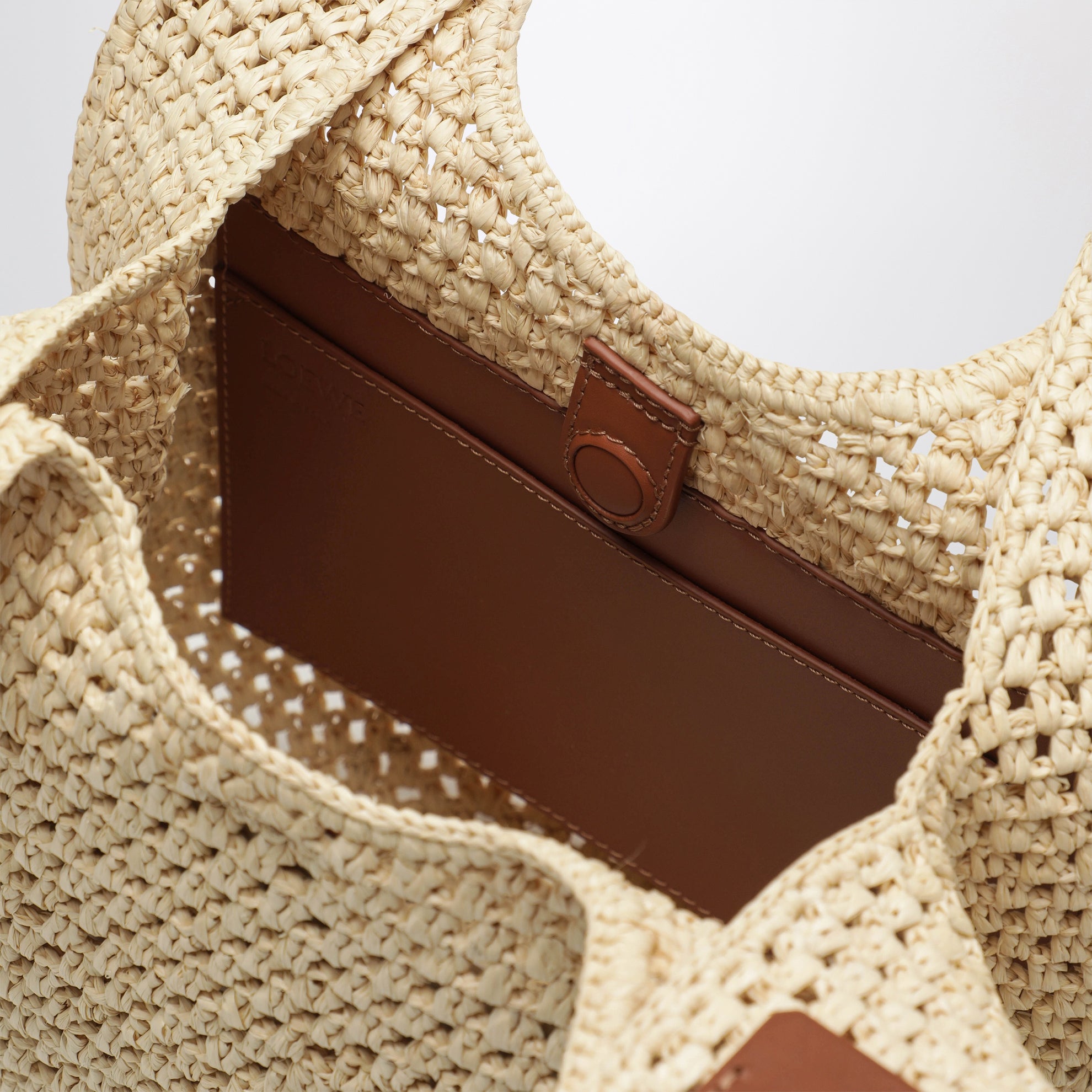 Small raffia and leather Punch Hole hobo bag