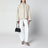 Small Le Teckel shoulder bag in black calfskin