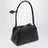 Small Le Teckel shoulder bag in black calfskin