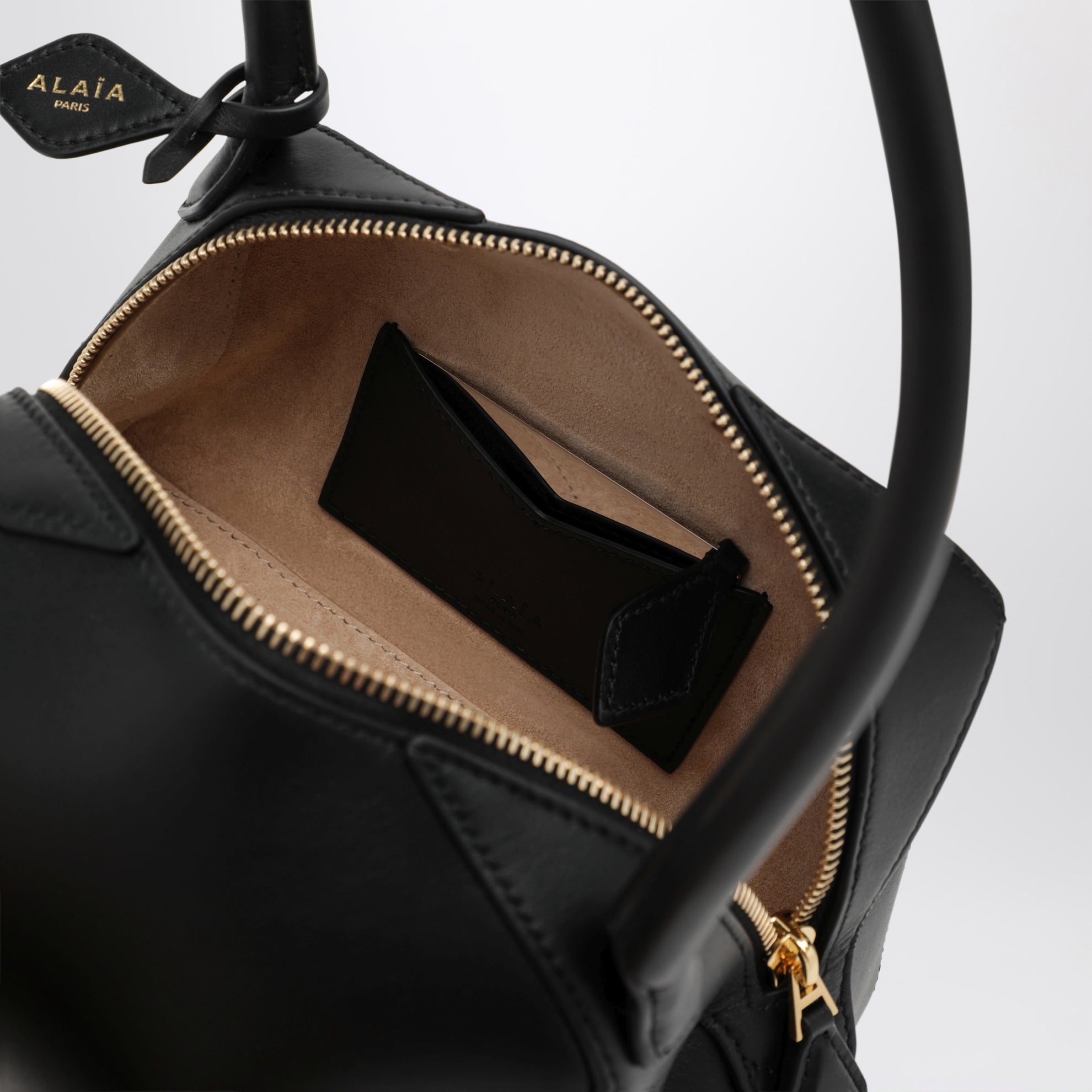 Small Le Teckel shoulder bag in black calfskin