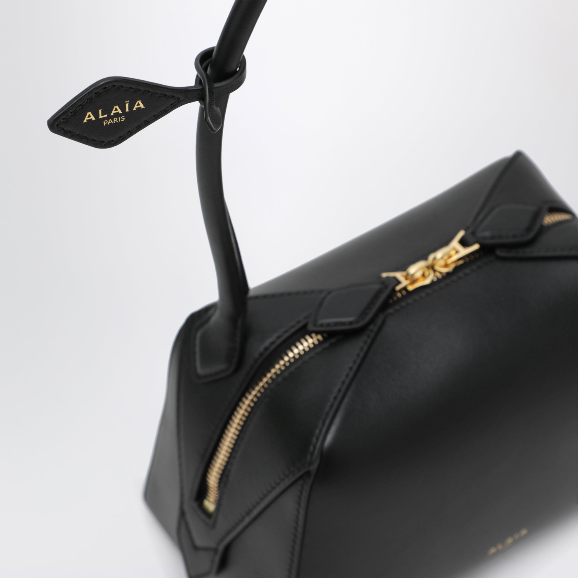 Small Le Teckel shoulder bag in black calfskin