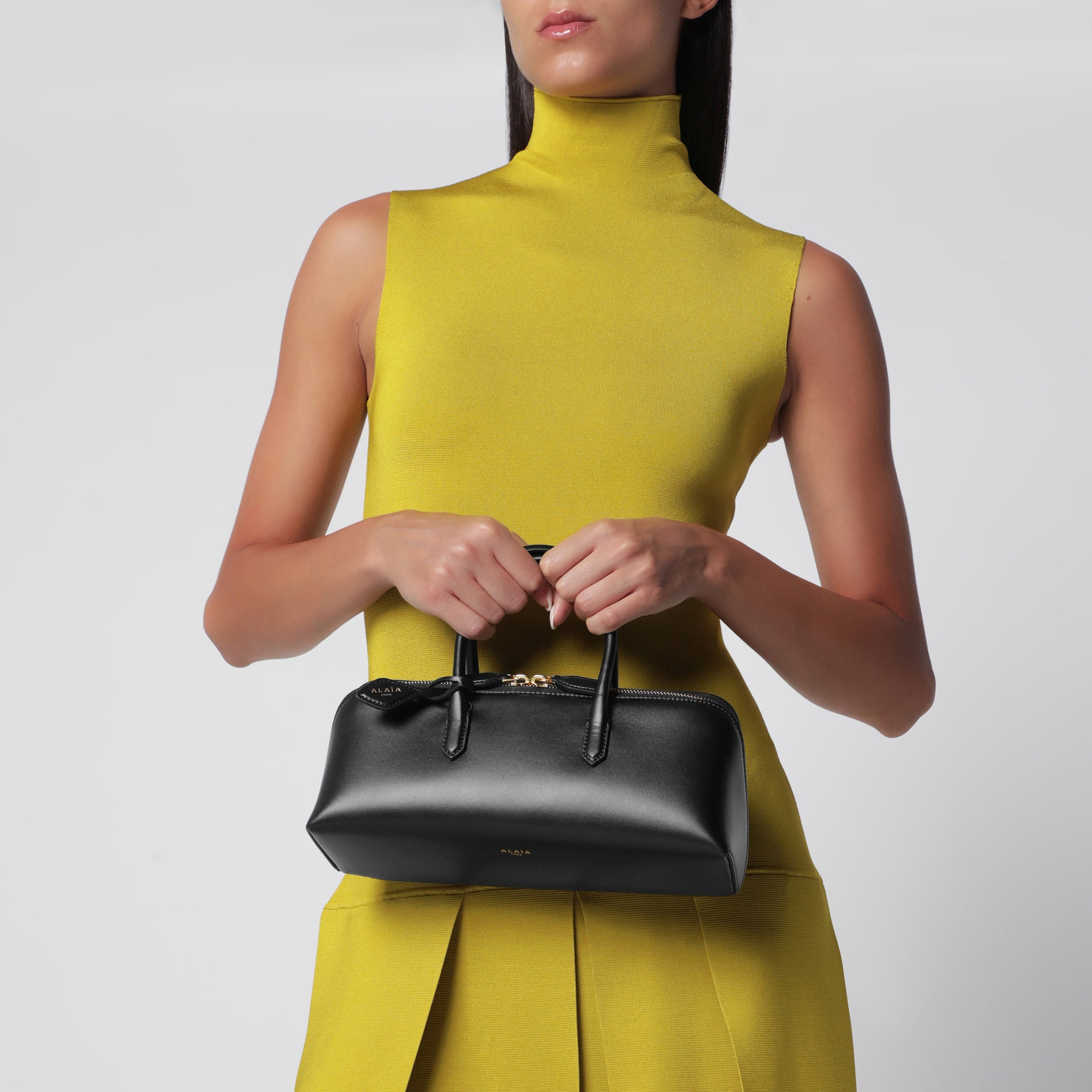 Small Delta bag in black box calf leather
