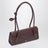 Le Teckel Small Tasche aus granatrotem Leder