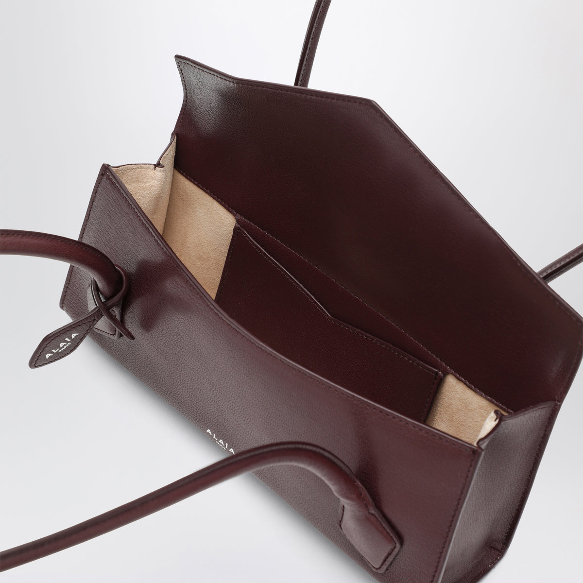 Le Teckel Small Tasche aus granatrotem Leder