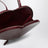Dark red patent leather Le Coeur bag