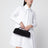 Pochette Le Teckel in pelle scamosciata nera
