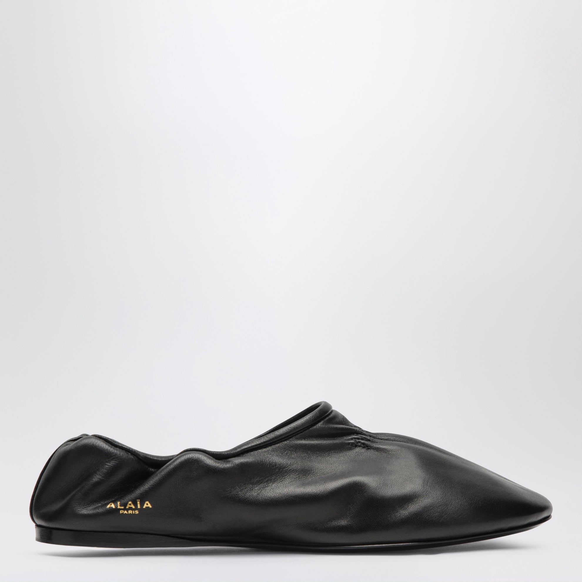 Soft slippers in black leather
