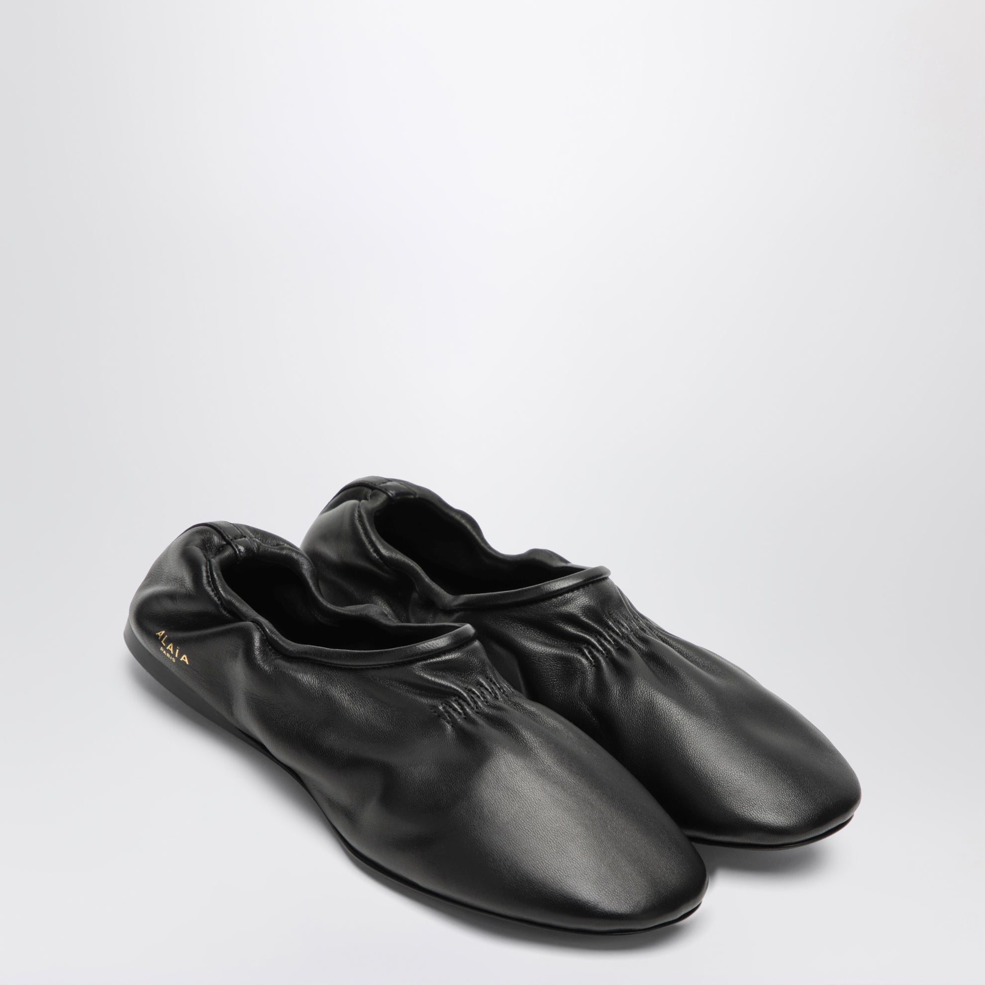Soft slippers in black leather