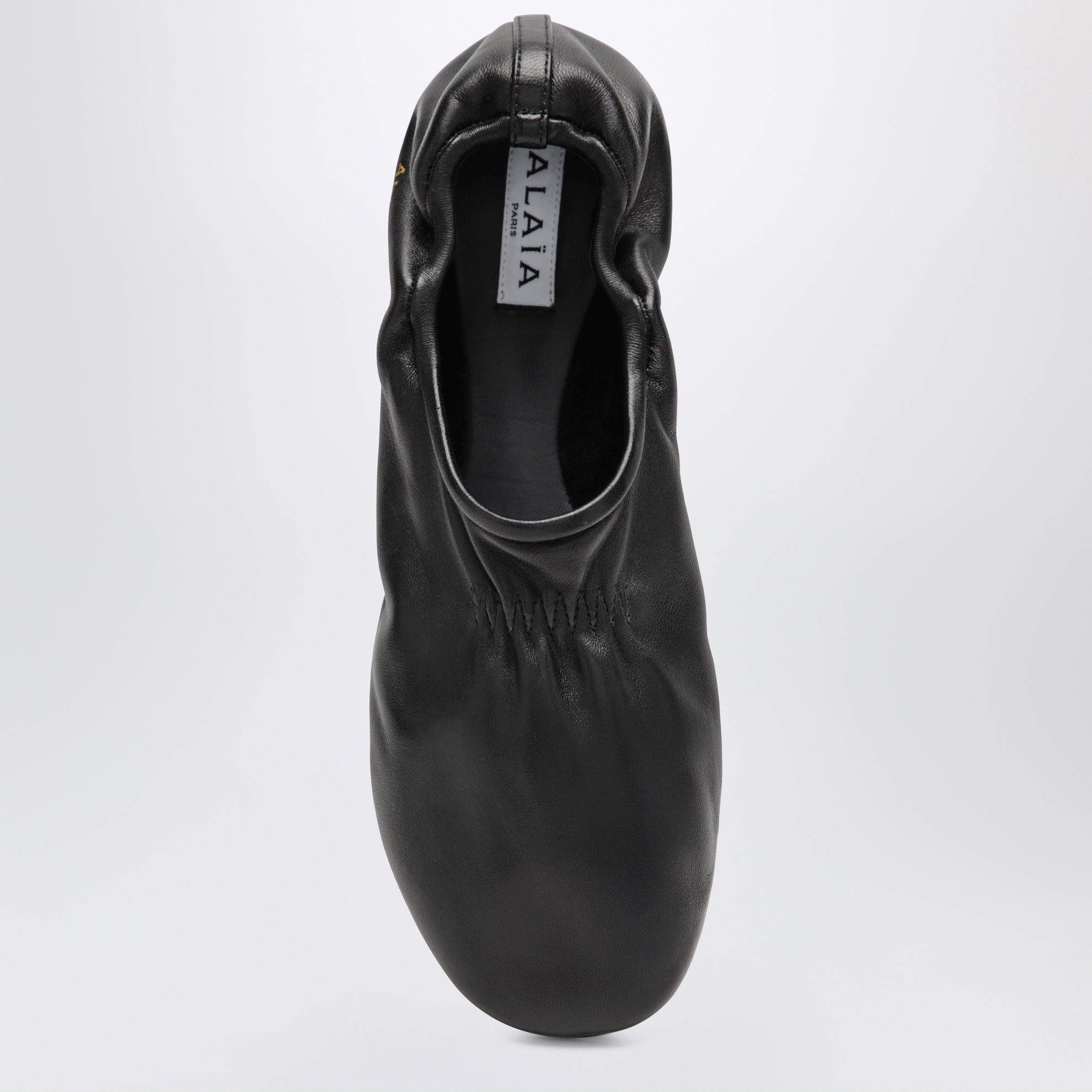 Soft slippers in black leather
