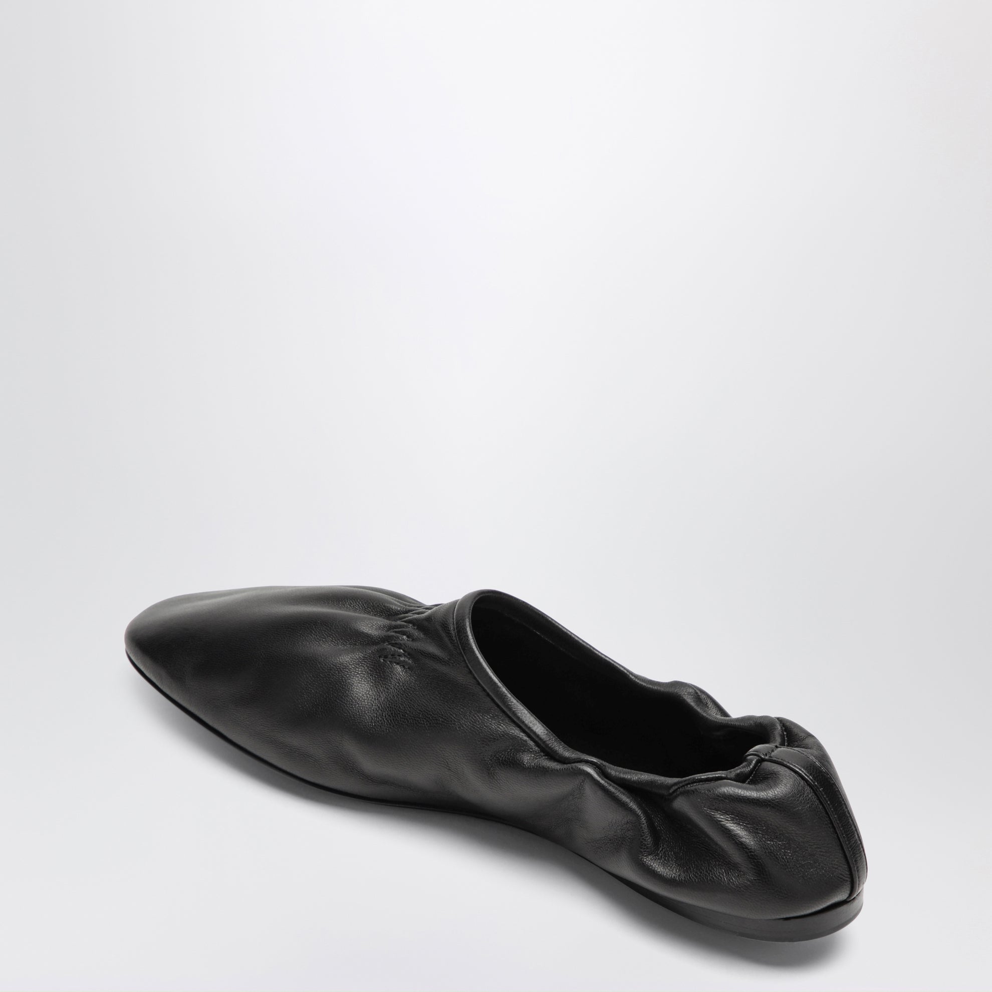 Soft slippers in black leather