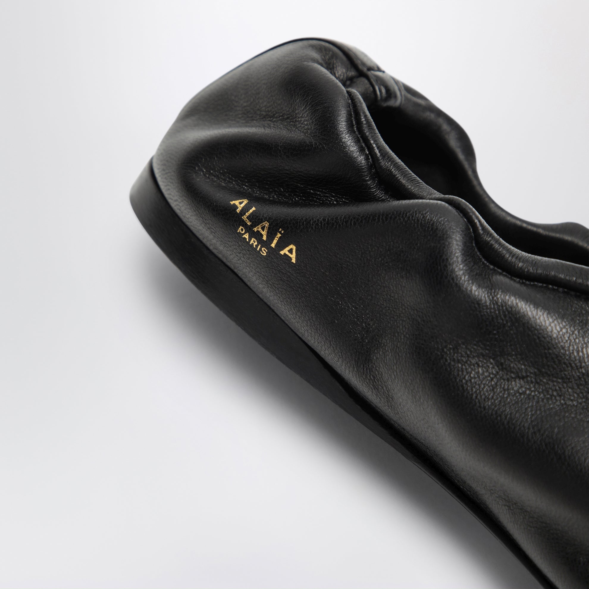 Soft slippers in black leather