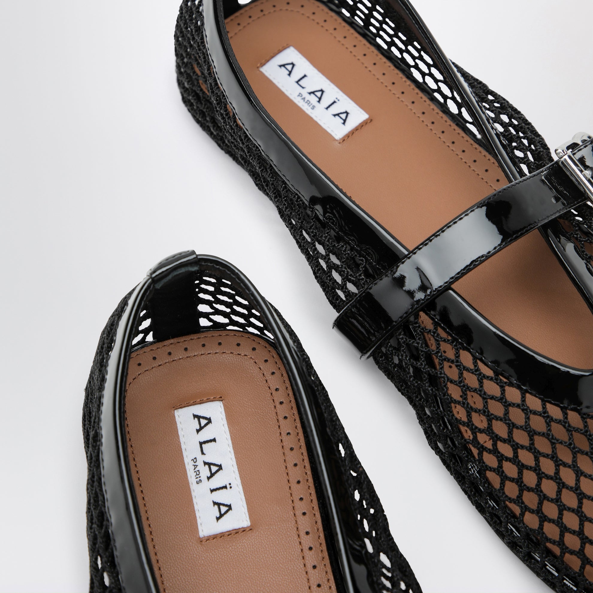 Ballerine stringate pieghevoli in nylon e suede nere