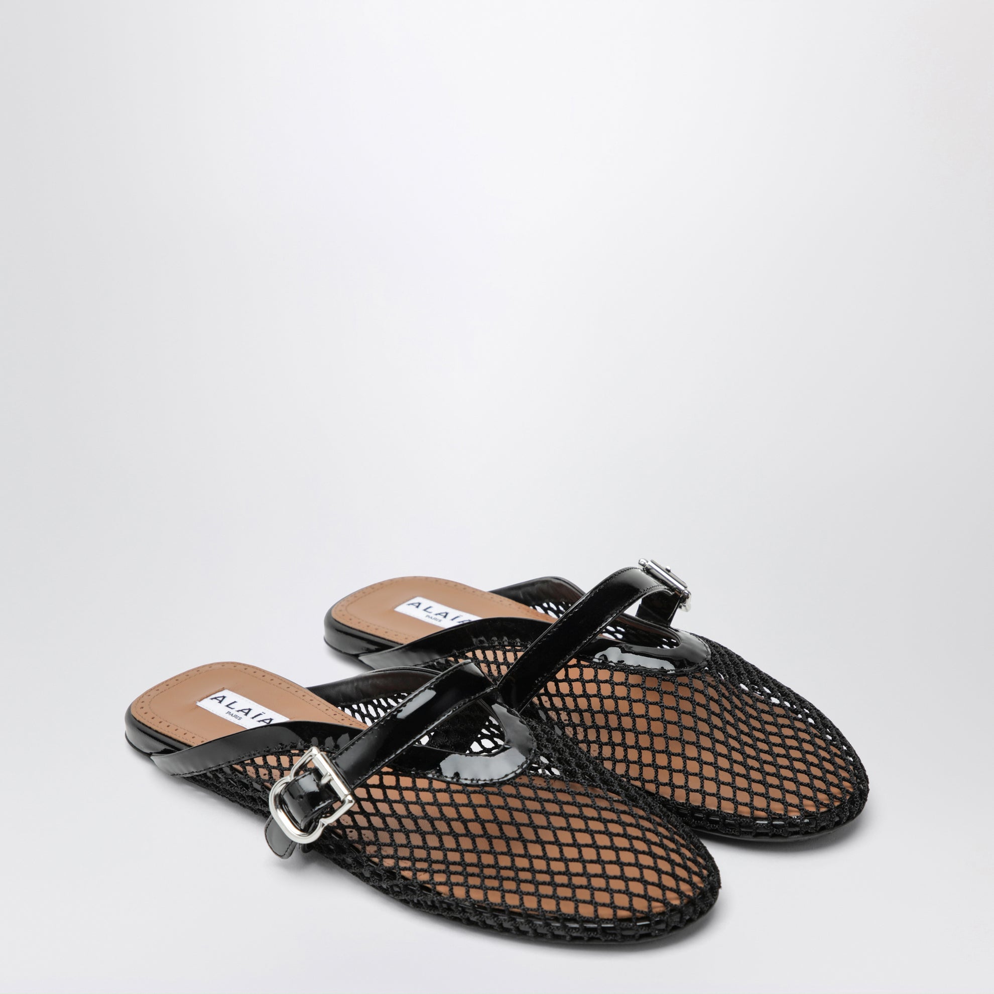 Flat mesh mules with buckle strap in black