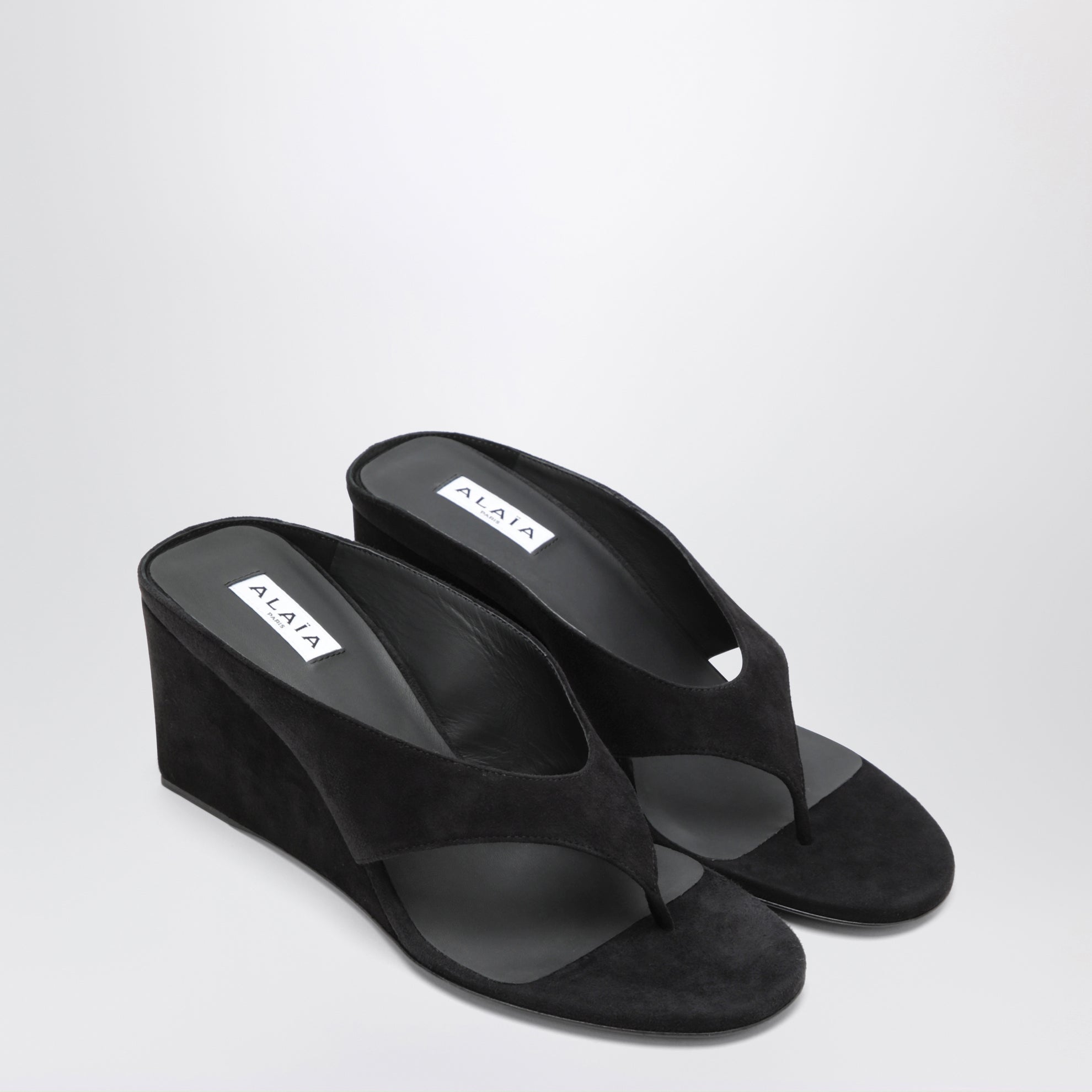 Mule infradito con zeppa in suede nere