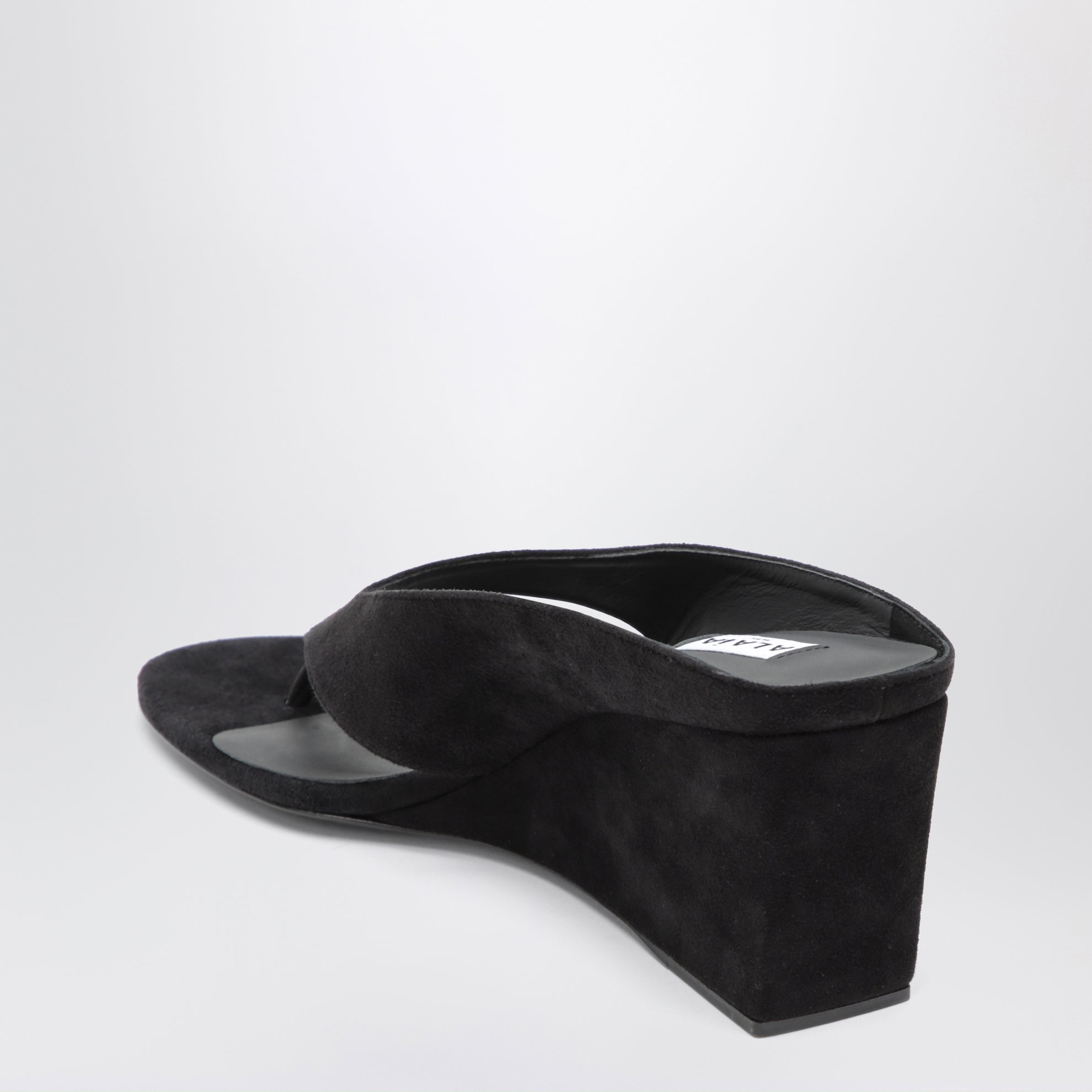 Mule infradito con zeppa in suede nere