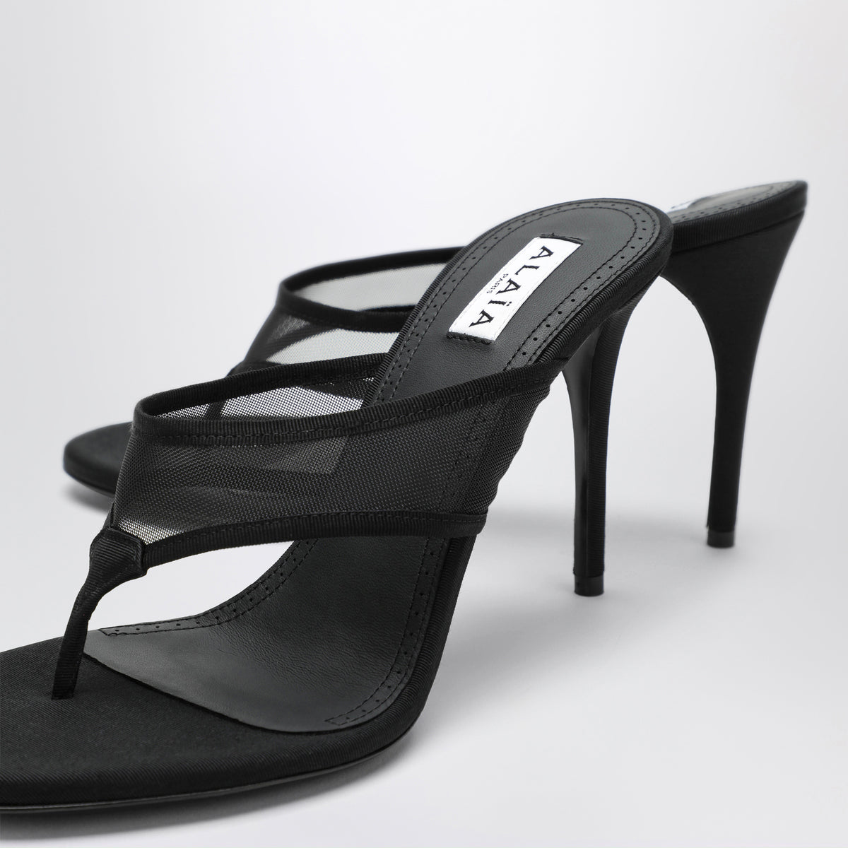 Black mesh flip-flop mules