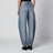 Low-rise curved-leg raw denim jeans in blue