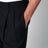 Blue pleated trousers with pinstripe pattern