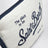 Pochette bianca/blu con logo