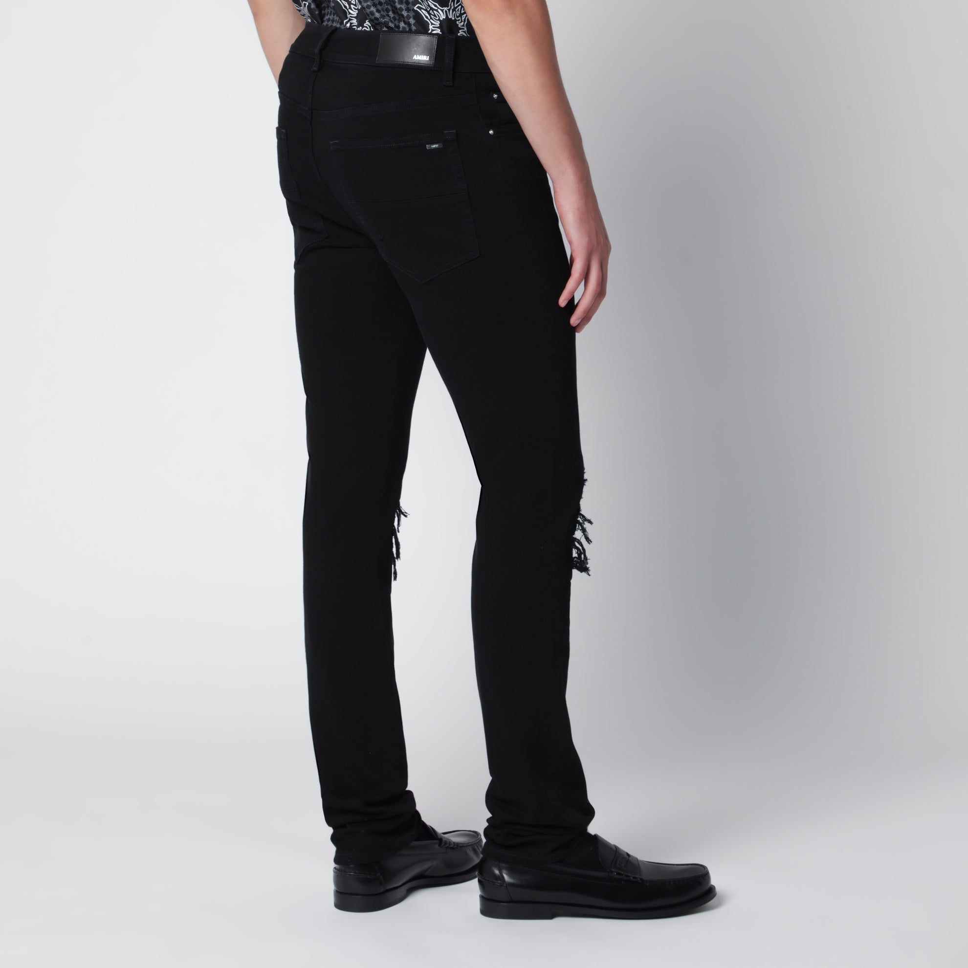 Jeans skinny strappati in cotone neri
