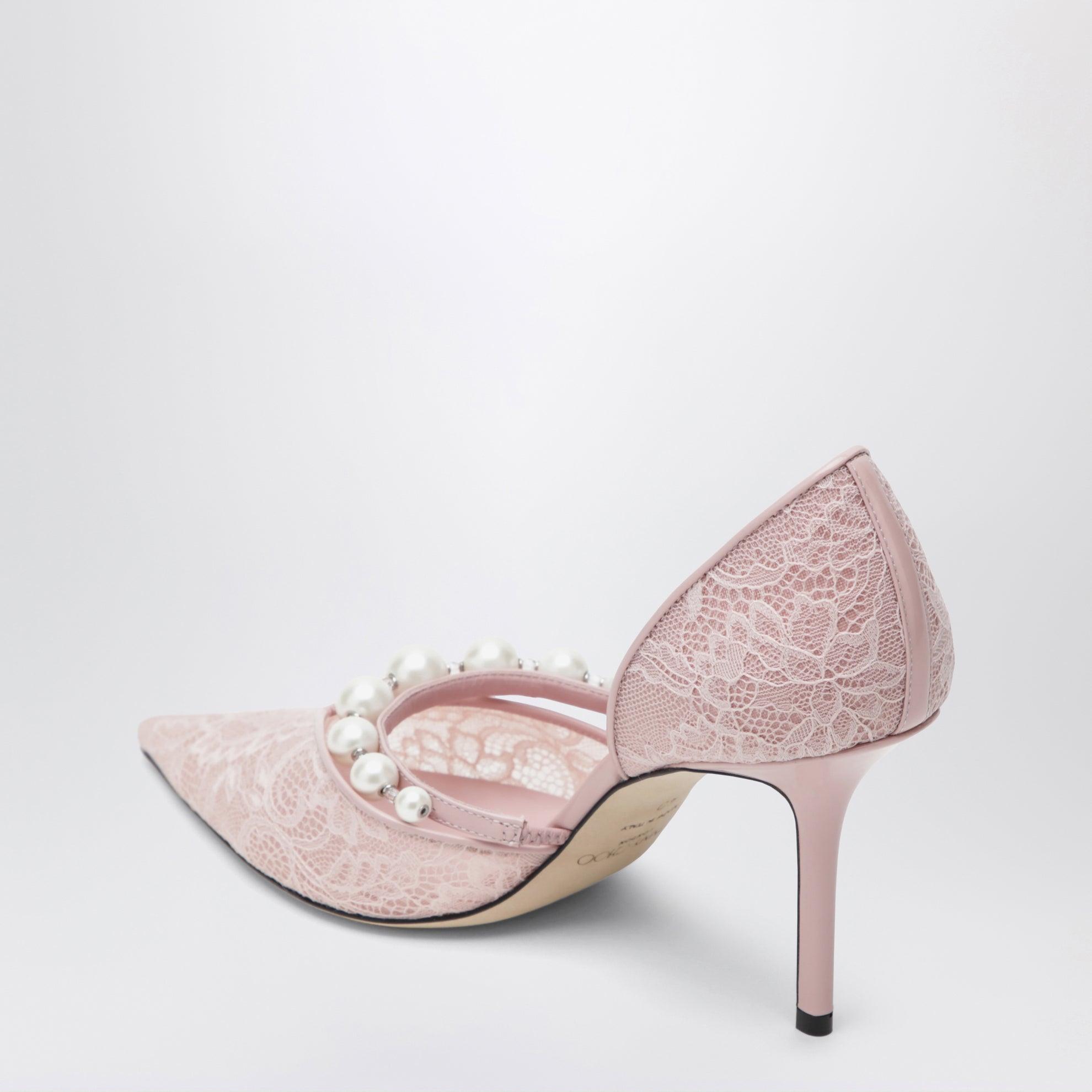 Décolleté in pizzo rosa con decorazione con perle