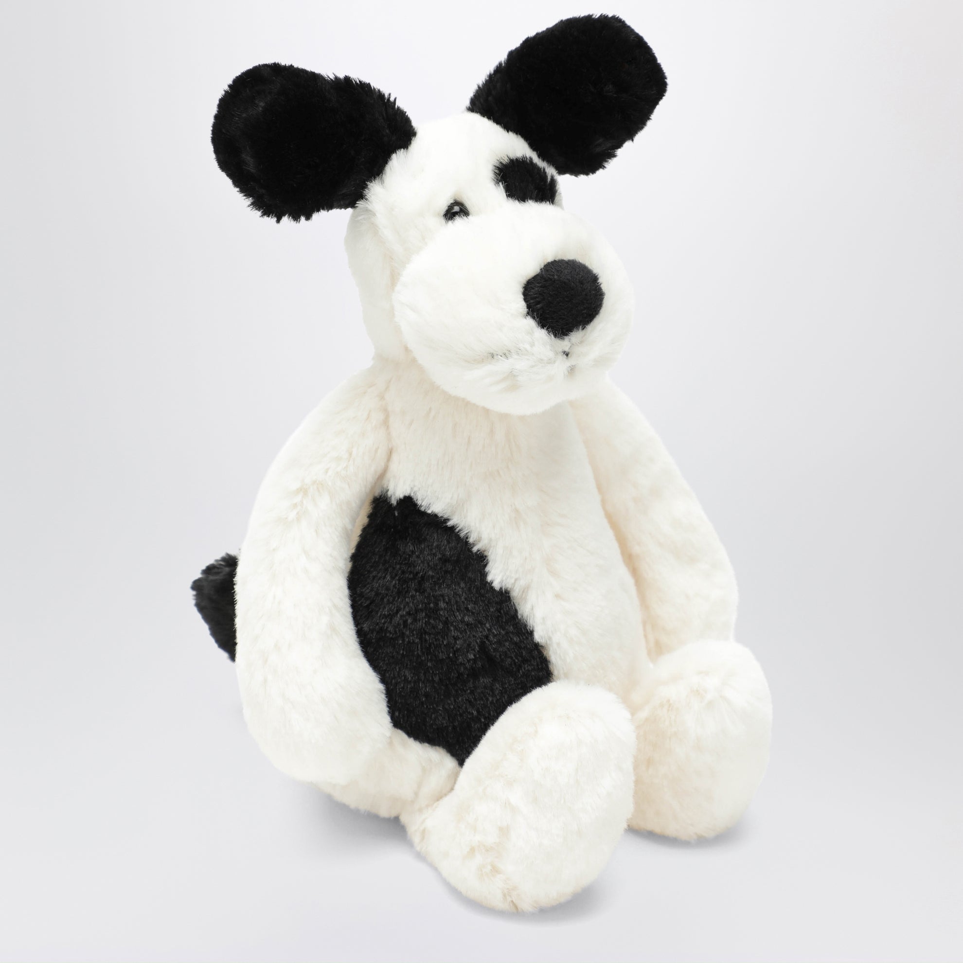 Peluche a forma di cagnolino bianco/nero