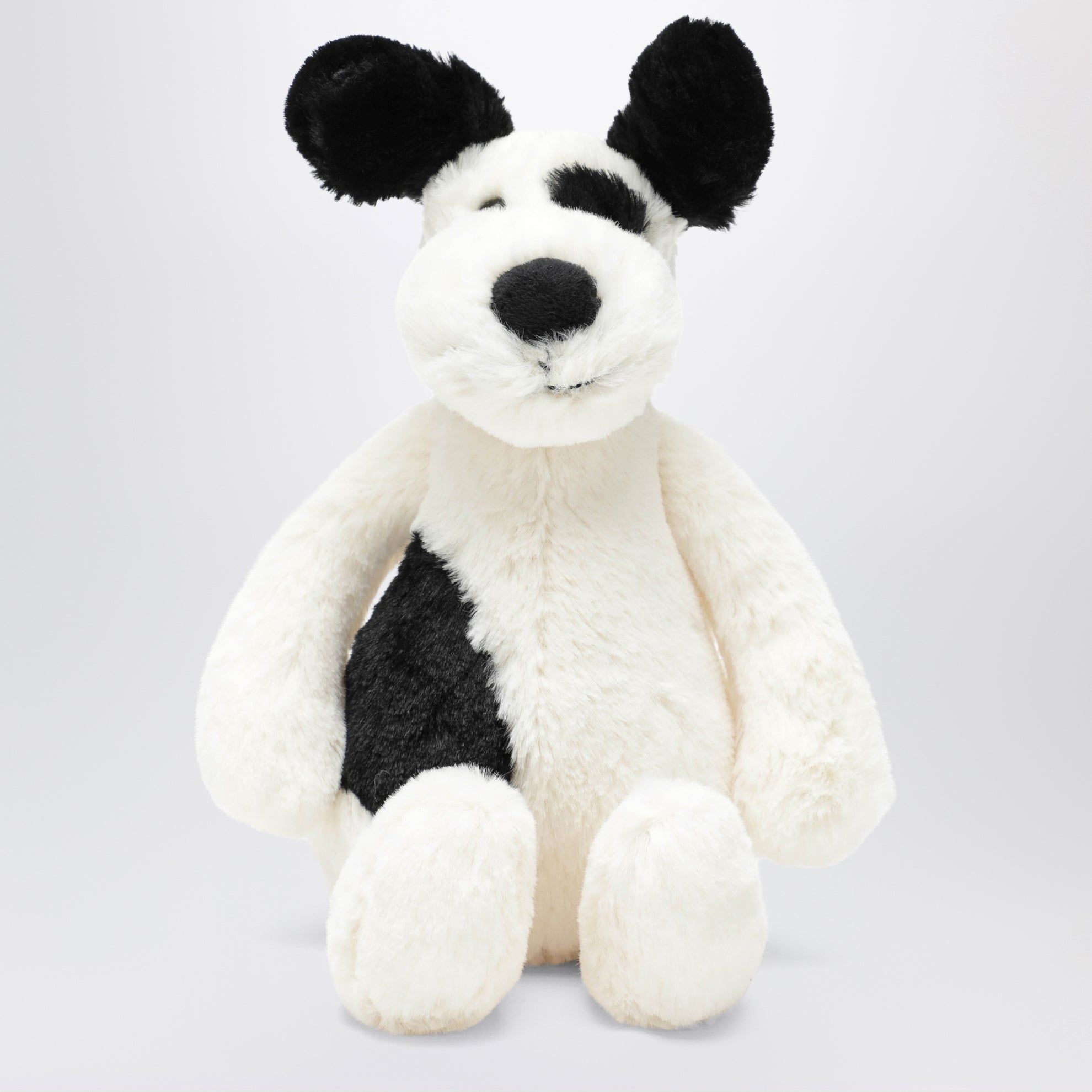 Peluche a forma di cagnolino bianco/nero